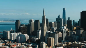 A city skyline, the image taken from an aerial photography drone